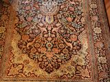 a large oriental rug on the floor in a living room