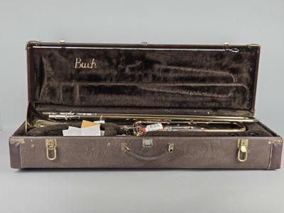 a case with a trumpet inside of it on a table