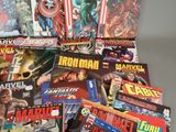 a lot of comic books sitting on a table