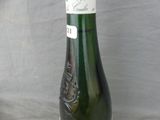 a bottle of wine that is sitting on a table