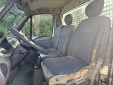 the interior of a van with a dirty seat and steering wheel