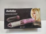 the box of the babylis hair dryer is open on the table