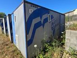 a blue and white sign on the side of a building
