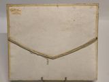 an old envelope with a string wrapped around it