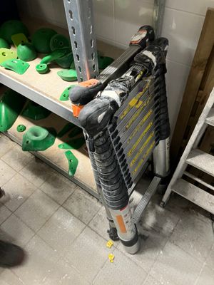 a ladder that is leaning against a wall in a room