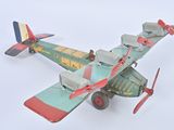 a toy airplane that is flying in the sky