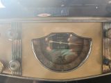 a close up of a clock on the side of a car
