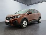 l'avant d'un SUV marron garé dans un garage