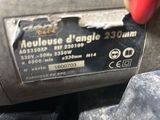 a person that is holding a machine with a label on it
