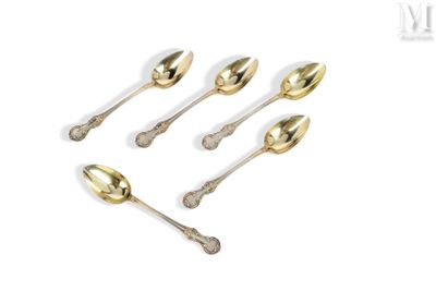 four spoons and a spoon rest in a row on a white surface