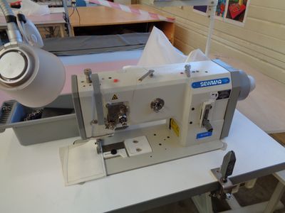 a sewing machine sitting on a table in a room
