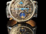 a close up of a watch with a reflection on a table