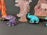 five figurines of different shapes and sizes on a table