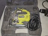 a yellow and black tool in a case on a table
