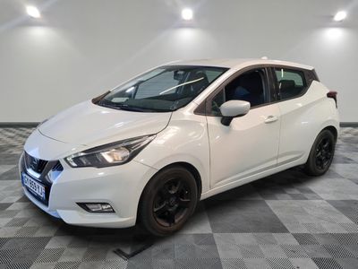the white car is parked in the garage on a checkered floor