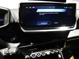 the dashboard of a car with a digital display in the center of it