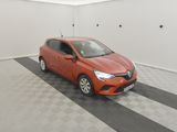 the orange car is parked in the garage on the checkered floor