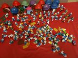 a lot of smurfs on a red table cloth
