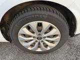 a close up of a tire on a white car