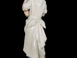 a figurine of a man with a robe on