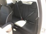 two seats in the back of a car with a seat belt