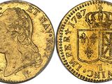 a gold sovereign coin with a crown on top of it