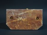 a brown marble box with a gold clasp on it