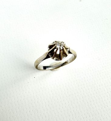 an image of a diamond ring on a white surface
