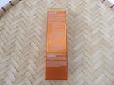 an orange box sitting on top of a wooden table