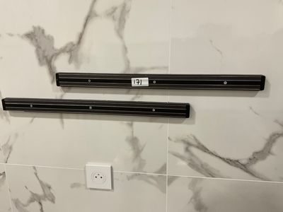 two speakers that are on the wall in the bathroom