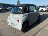 a small car that is parked in a parking lot