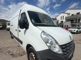 the white van is parked in a parking lot with other cars