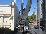an image of a truck with a crane on it ' s back