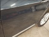 a picture of a car door with a sticker on it
