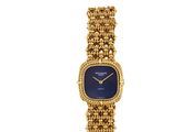 une montre-bracelet pour femme en or jaune 18 carats avec un cadran bleu