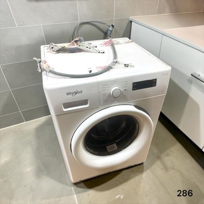 a washer and dryer in a small room
