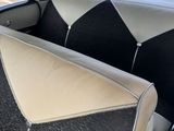 a black and white seat in the back of a car