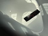 a sticker that is sitting on the hood of a car