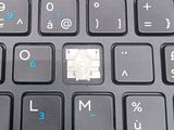 a close up of a computer keyboard with a micro chip on it