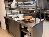 a large kitchen with a lot of dishes on the counter