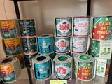 many tins of different colors and sizes on display