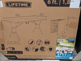 a cardboard box with a picture of a table inside of it