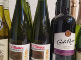 several bottles of wine are lined up on a table