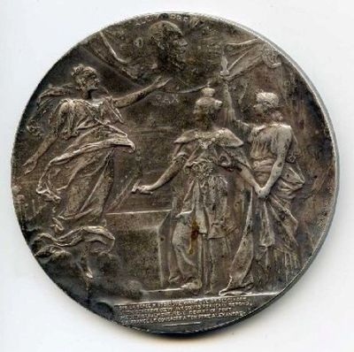 une vieille pièce d'argent sur laquelle sont représentés une femme et un homme