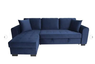 un canapé modulable bleu avec des coussins et un repose-pieds