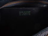the inside of a black purse with a zipper on it
