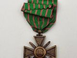 a close up of a medal with a cross on it