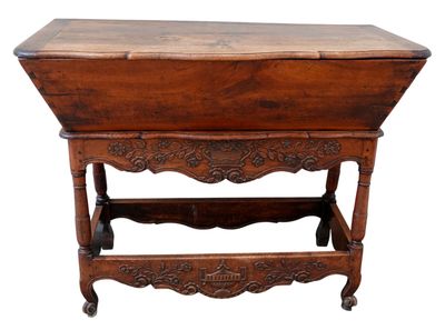 a small wooden table with a drawer on top of it