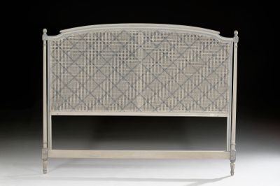 a white headboard with a diamond pattern on it