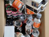a cardboard box filled with many different types of bottles